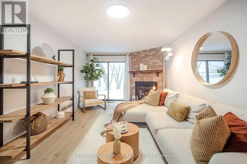 20 Muirbank Boulevard, Toronto, ON - Indoor Photo Showing Living Room With Fireplace
