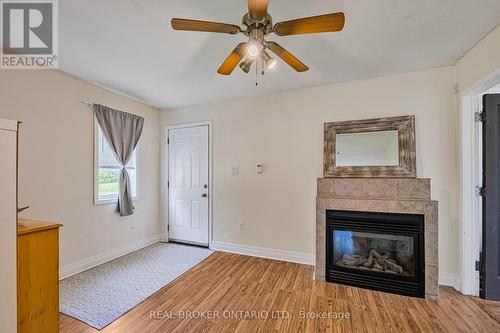5520 County Road 90 Road, Springwater, ON - Indoor Photo Showing Living Room With Fireplace