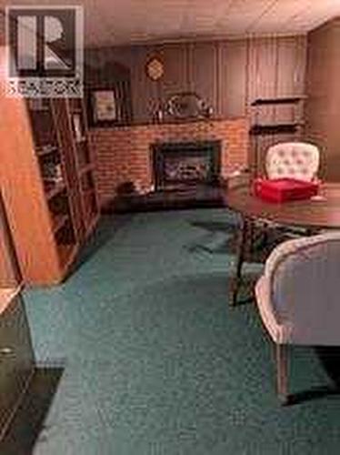 10212 8 Street Sw, Calgary, AB - Indoor Photo Showing Other Room With Fireplace