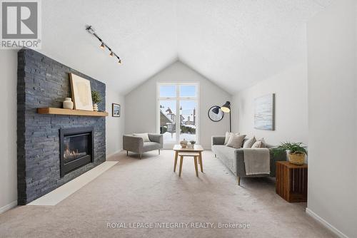 23 Pemberton Crescent, Ottawa, ON - Indoor Photo Showing Living Room With Fireplace