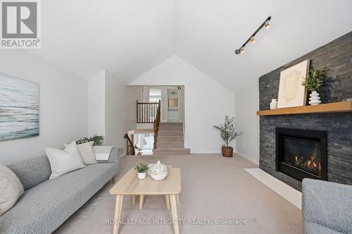 23 Pemberton Crescent, Ottawa, ON - Indoor Photo Showing Living Room With Fireplace