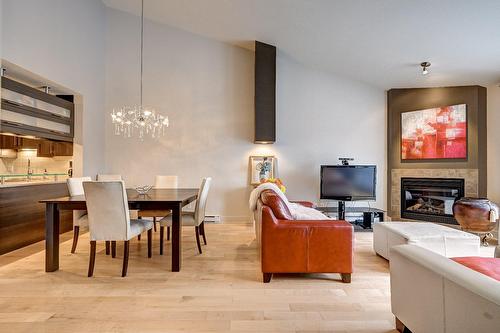 Overall view - 402-651 Rue Jacques-Lavigne, Sainte-Thérèse, QC - Indoor Photo Showing Dining Room With Fireplace