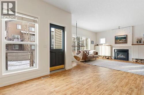 196 Jumping Pound Terrace, Cochrane, AB - Indoor Photo Showing Living Room With Fireplace