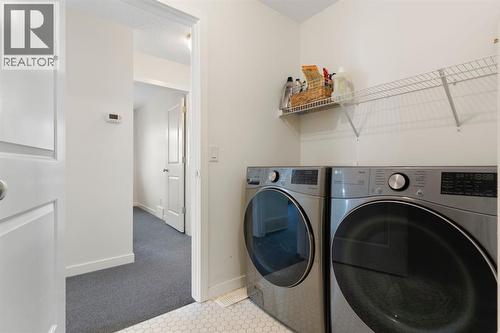 196 Jumping Pound Terrace, Cochrane, AB - Indoor Photo Showing Laundry Room