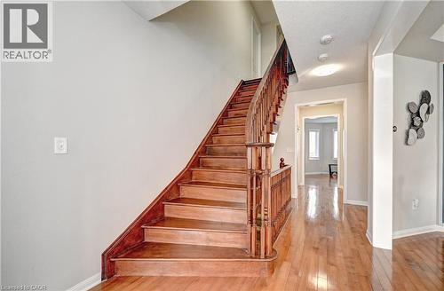 Stairway featuring wood-type flooring and baseboards - 32 Weir Street, Cambridge, ON - Indoor Photo Showing Other Room