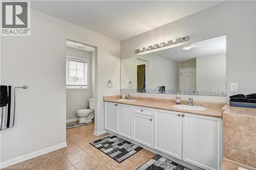 Bathroom with double vanity and light tile patterned flooring - 32 Weir Street, Cambridge, ON - Indoor Photo Showing Bathroom