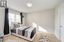 Bedroom featuring carpet floors and baseboards - 