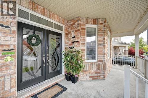 View of exterior entry with covered porch and brick siding - 32 Weir Street, Cambridge, ON - Outdoor
