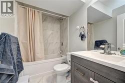 Full bath with shower / bath combo with shower curtain and vanity - 