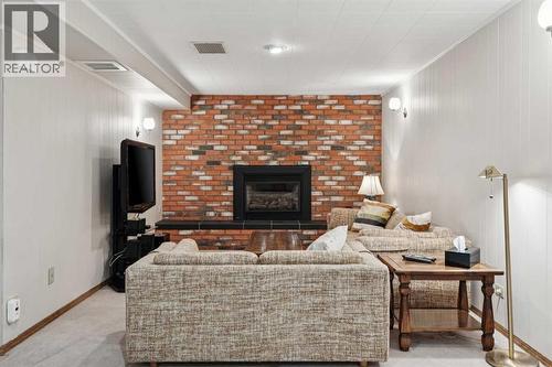 8603 Ashworth Road Se, Calgary, AB - Indoor Photo Showing Living Room With Fireplace
