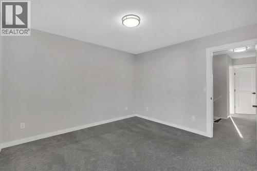 17 Mckernan Road Se, Calgary, AB - Indoor Photo Showing Other Room