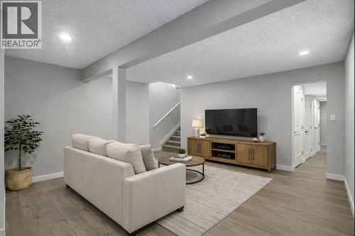 Virtually Staged basment living/flex room - 17 Mckernan Road Se, Calgary, AB - Indoor