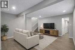 Virtually Staged basment living/flex room - 