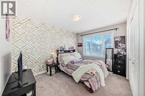 656 Copperpond Boulevard Se, Calgary, AB - Indoor Photo Showing Bedroom