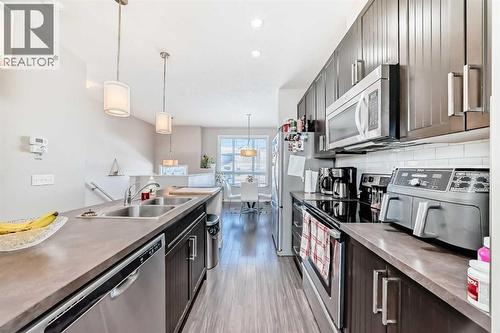 656 Copperpond Boulevard Se, Calgary, AB - Indoor Photo Showing Kitchen With Double Sink With Upgraded Kitchen