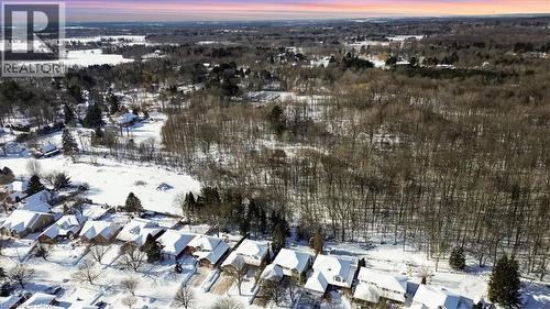 Snowy aerial view with view of scattered trees - 25 Meadowvale Drive Unit# 3, Fonthill, ON - Outdoor With View
