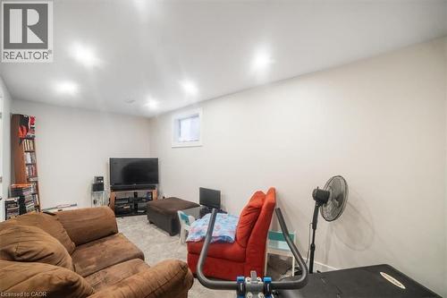 Living area with carpet floors - 25 Meadowvale Drive Unit# 3, Fonthill, ON - Indoor Photo Showing Basement