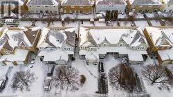Snowy aerial view featuring a residential view - 