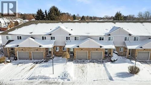 View of front of home featuring brick siding and a garage - 25 Meadowvale Drive Unit# 3, Fonthill, ON - Outdoor With Facade