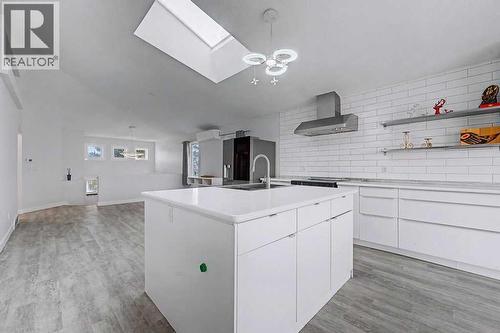 Giant Skylight Over Kitchen and Living Area - 267 Panamount Hill Nw, Calgary, AB - Indoor