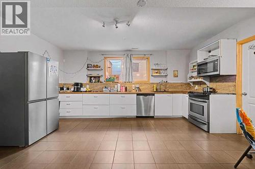 Legal Suite - 267 Panamount Hill Nw, Calgary, AB - Indoor Photo Showing Kitchen With Stainless Steel Kitchen