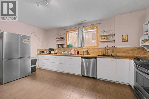 Legal Suite - 267 Panamount Hill Nw, Calgary, AB - Indoor Photo Showing Kitchen With Stainless Steel Kitchen