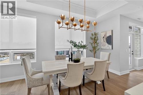 NEW Visual Comfort & Co gold leaf light fixture - 123 Maurice Drive Unit# 401, Oakville, ON - Indoor Photo Showing Dining Room