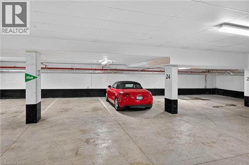 3 side by side parking all w/ EV rough-ins! - 123 Maurice Drive Unit# 401, Oakville, ON - Indoor Photo Showing Garage