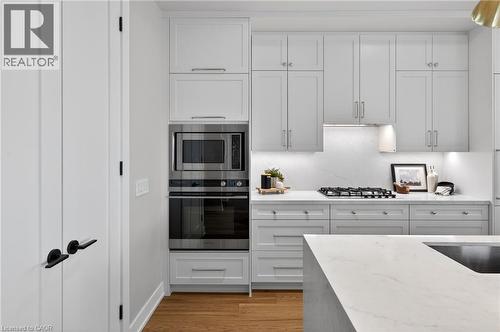 Extended cabinet height to 9 ft - 123 Maurice Drive Unit# 401, Oakville, ON - Indoor Photo Showing Kitchen With Upgraded Kitchen