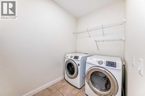 105 Elgin Meadows Circle Se, Calgary, AB - Indoor Photo Showing Laundry Room