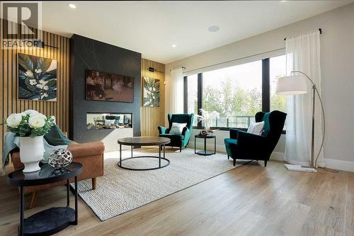 125 Emerald Drive, Red Deer, AB - Indoor Photo Showing Living Room With Fireplace