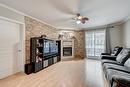 Living room - 1-19 Av. Papineau, Candiac, QC  - Indoor Photo Showing Living Room With Fireplace 