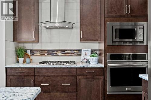 Gas cooktop, built-in oven and microwave - 69 Ravenskirk Close Se, Airdrie, AB - Indoor Photo Showing Kitchen