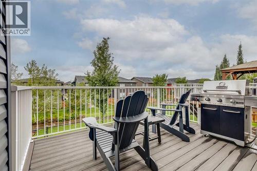 West facing deck - Views of the greenspace behind - 69 Ravenskirk Close Se, Airdrie, AB - Outdoor With Deck Patio Veranda With Exterior