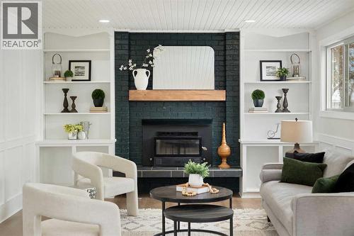 Family Room - 248 Madeira Place Ne, Calgary, AB - Indoor Photo Showing Living Room With Fireplace
