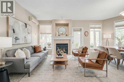 1113, 1113 Lake Fraser Green Se, Calgary, AB - Indoor Photo Showing Living Room With Fireplace
