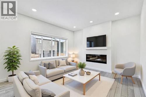 1124 Chinook Gate Bay Sw, Airdrie, AB - Indoor Photo Showing Living Room With Fireplace