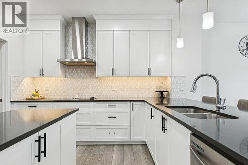 1124 Chinook Gate Bay Sw, Airdrie, AB - Indoor Photo Showing Kitchen With Double Sink With Upgraded Kitchen