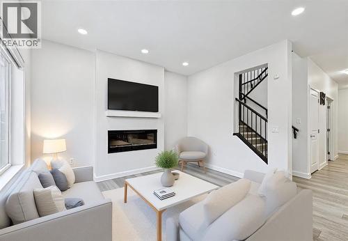 1124 Chinook Gate Bay Sw, Airdrie, AB - Indoor Photo Showing Living Room With Fireplace