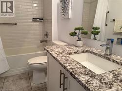 Full bathroom with vanity and shower / bath combo with shower curtain - 
