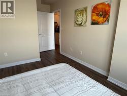 Bedroom with baseboards and dark wood-style floors - 