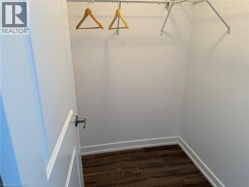 View of walk in closet - 35 Southshore Crescent Unit# 303, Stoney Creek, ON - Indoor With Storage
