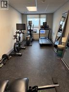 Workout room featuring a drop ceiling - 