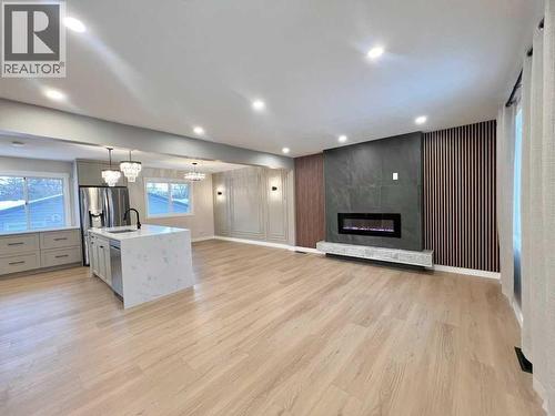 146 Springwood Drive Sw, Calgary, AB - Indoor With Fireplace
