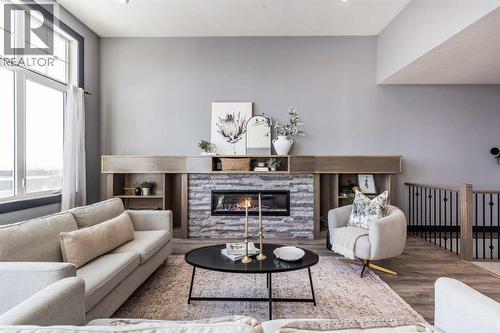 22 Palisades Lane Ne, Medicine Hat, AB - Indoor Photo Showing Living Room With Fireplace