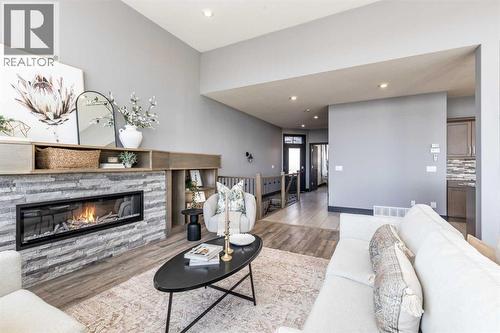 22 Palisades Lane Ne, Medicine Hat, AB - Indoor Photo Showing Living Room With Fireplace