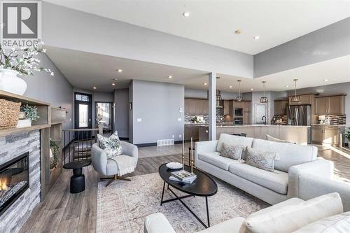 22 Palisades Lane Ne, Medicine Hat, AB - Indoor Photo Showing Living Room With Fireplace