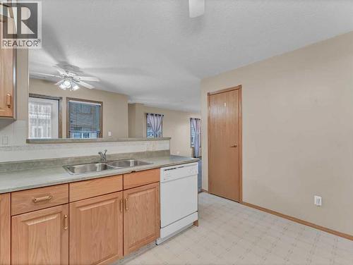 208, 1182 Southview Drive Se, Medicine Hat, AB - Indoor Photo Showing Kitchen With Double Sink