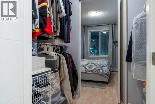 Primary walkin closet - 206, 2000 Citadel Meadow Point Nw, Calgary, AB - Indoor With Storage