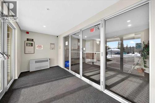 Front Entry - 206, 2000 Citadel Meadow Point Nw, Calgary, AB - Indoor Photo Showing Other Room